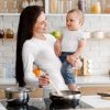 Mum holding baby boy wearing elephant BibEasy Bib